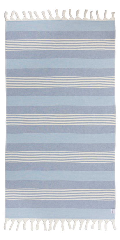 Striped blue and white rug with tassels on a white background