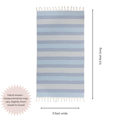 Blue and white striped towel with tassels on a white background, showing dimensions.