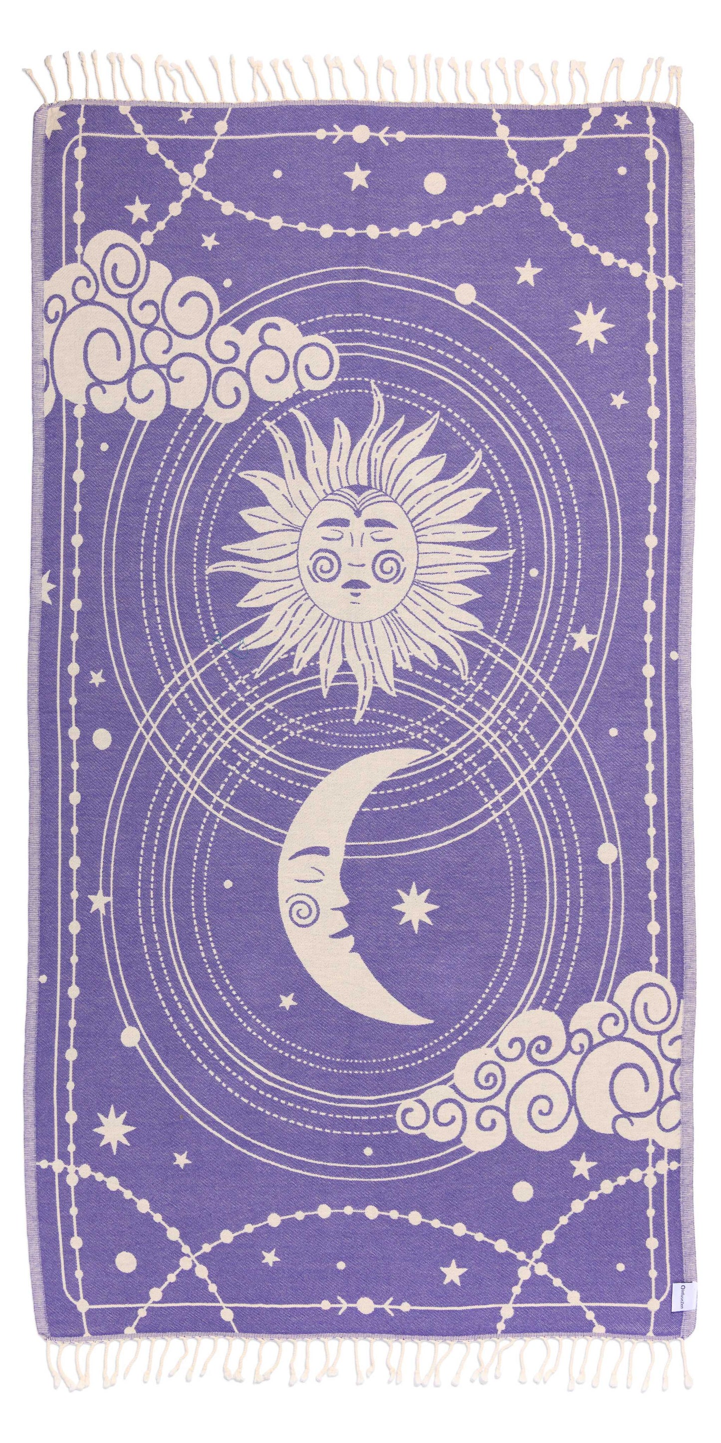 Towel with celestial design featuring sun, moon, and stars on a purple background