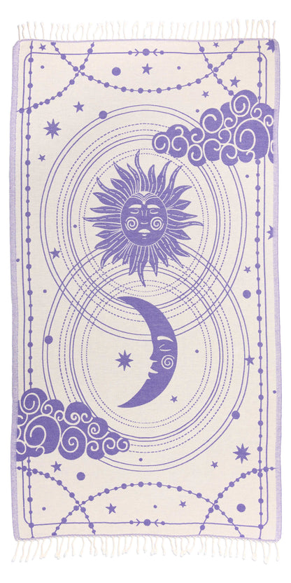 Towel with purple sun and moon design on a white background