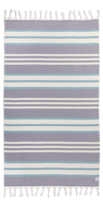 Purple and white striped towel on white background 