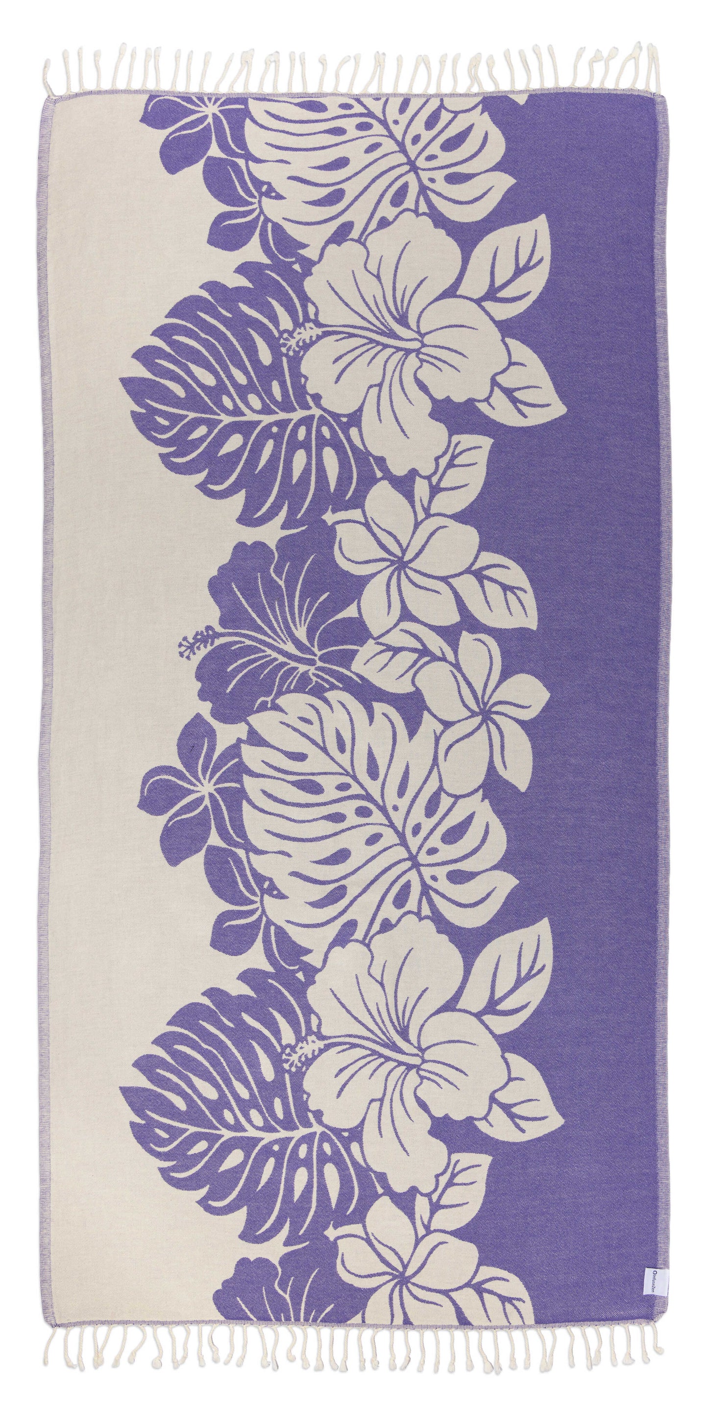 Towel with floral and leaf pattern on a purple background