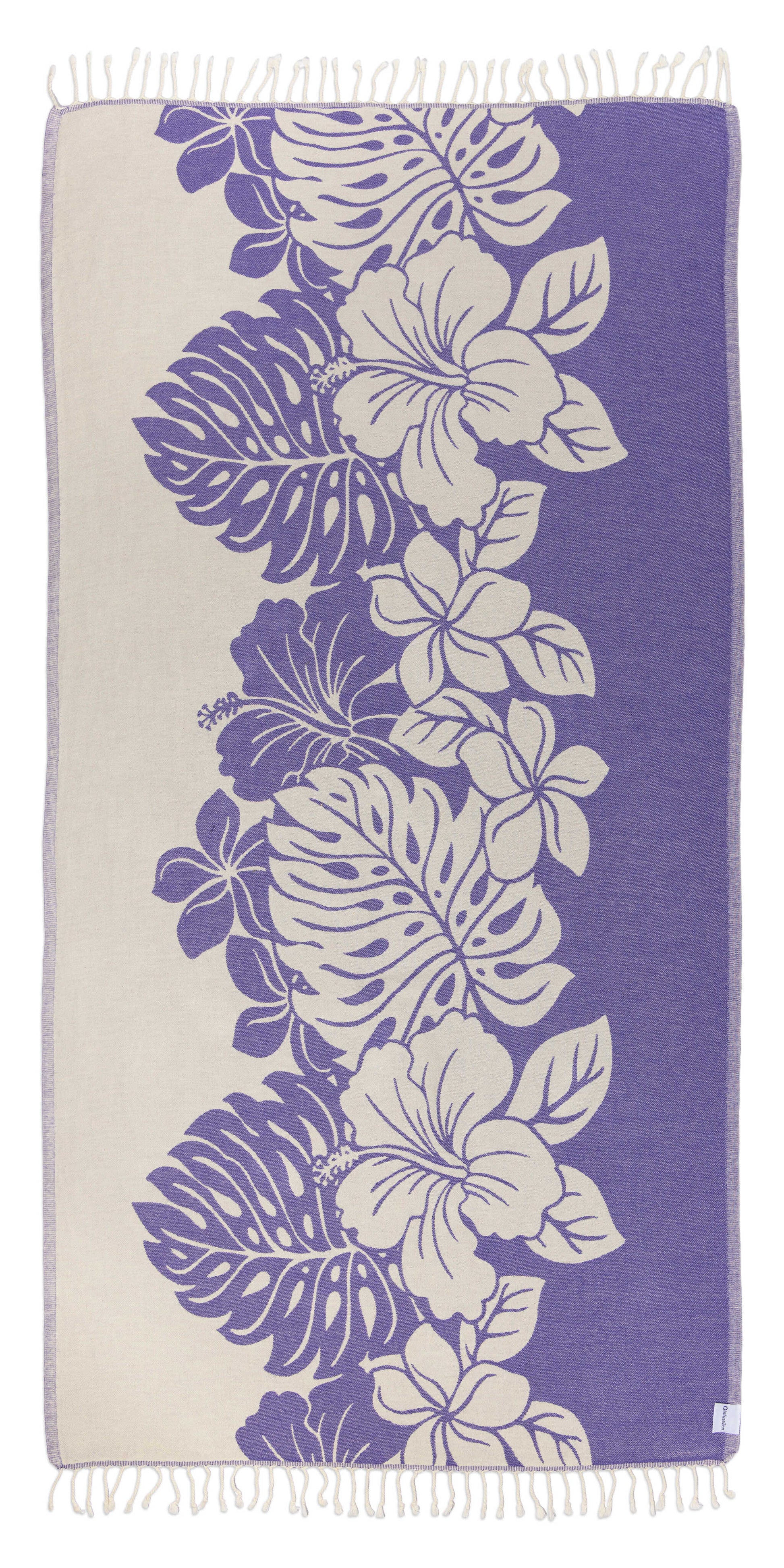 Towel with floral and leaf pattern on a purple background