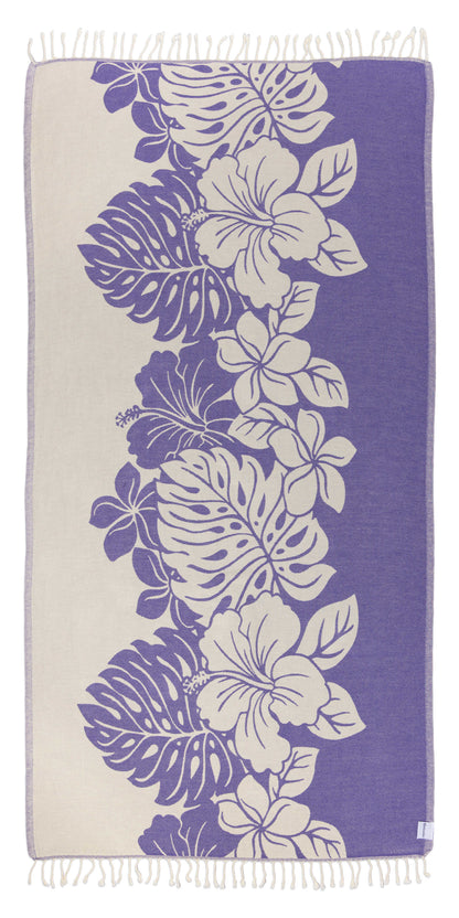 Towel with floral and leaf pattern on a purple background