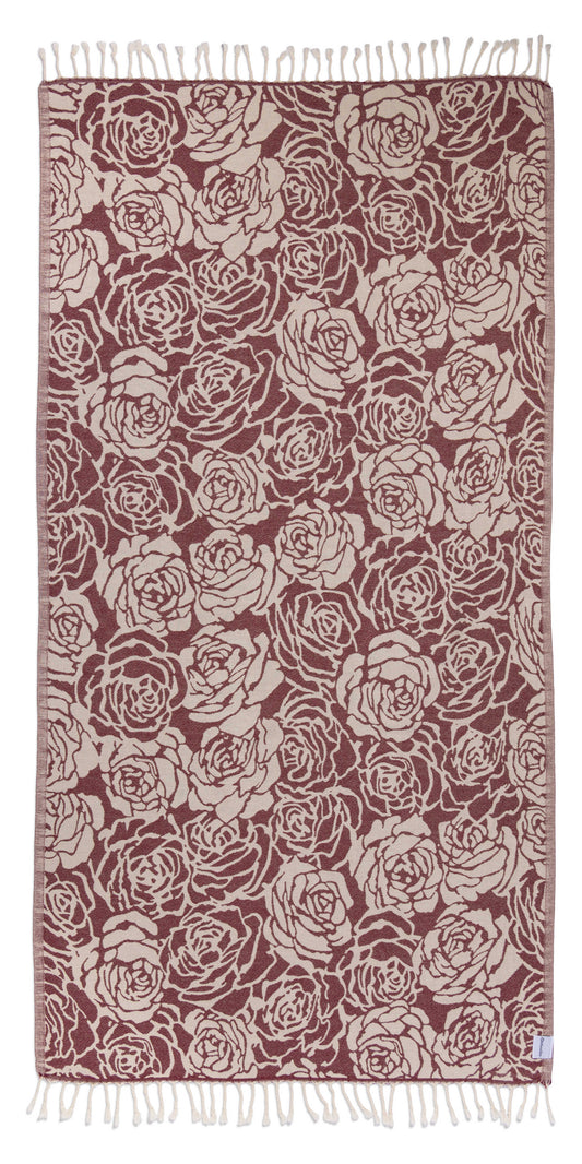Towel with rose pattern in red and beige on a white background