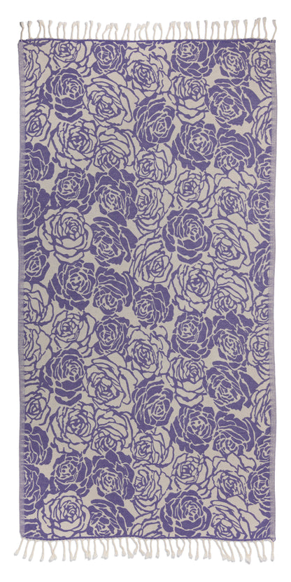 Patterned fabric with blue rose design on a white background