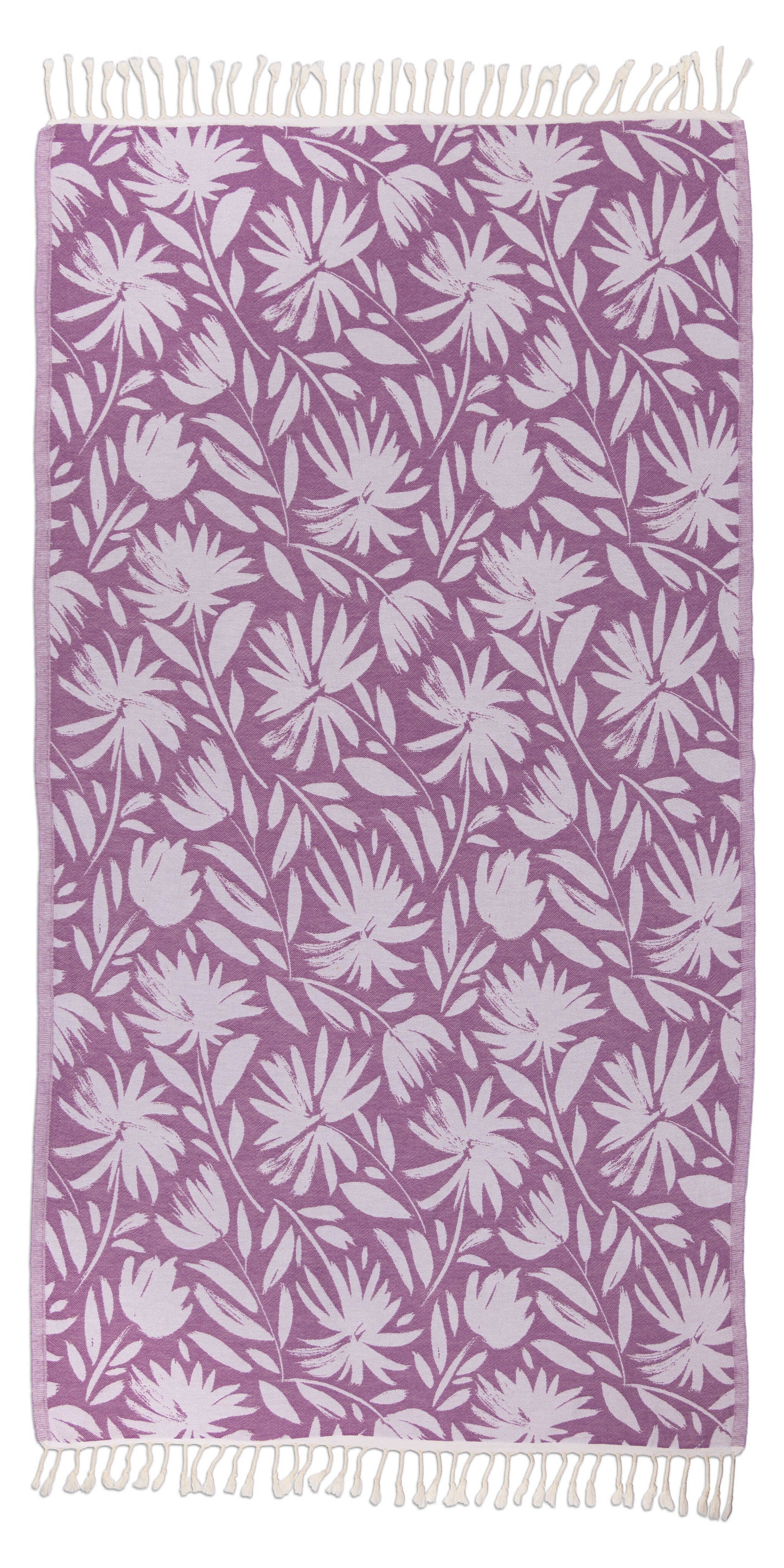 Floral patterned towel with white leaves on a purple background