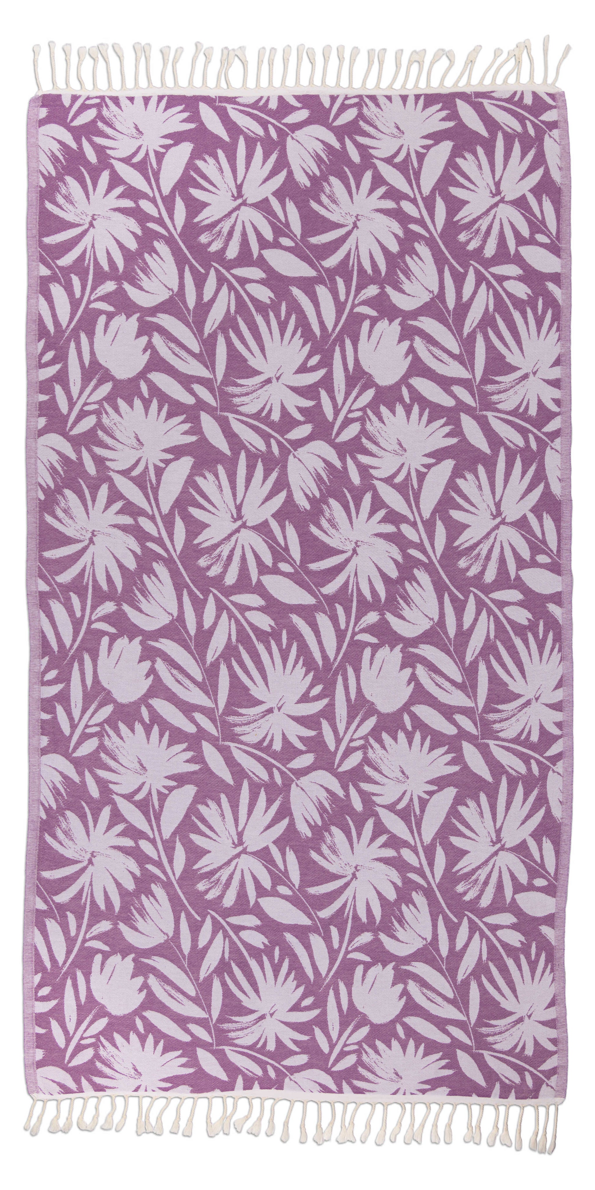 Floral patterned towel with white leaves on a purple background